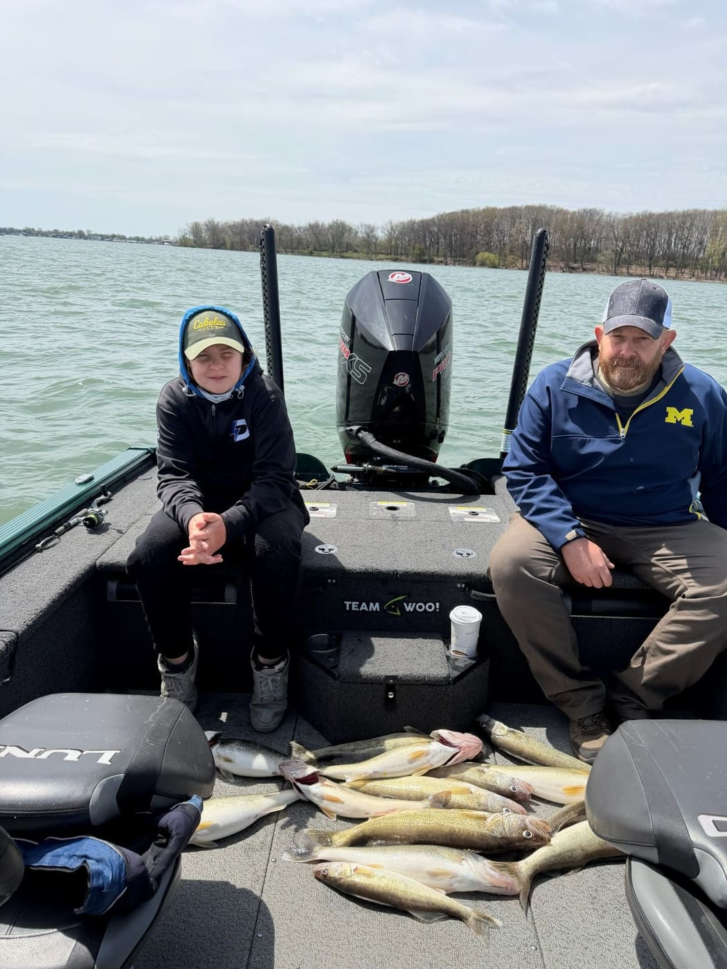 Clients aboard with a catch of walleye on the deck